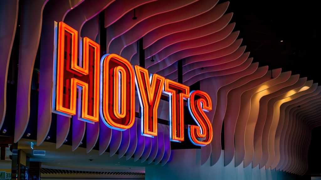 An illuminated HOYTS sign.