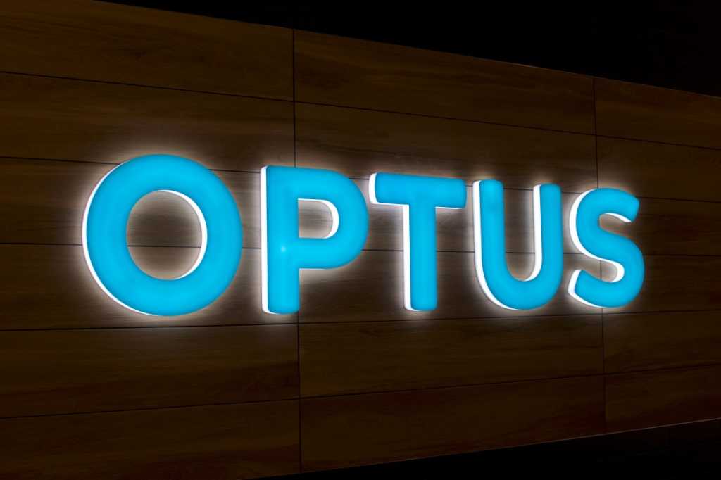 An illuminated sign of the Optus logo.