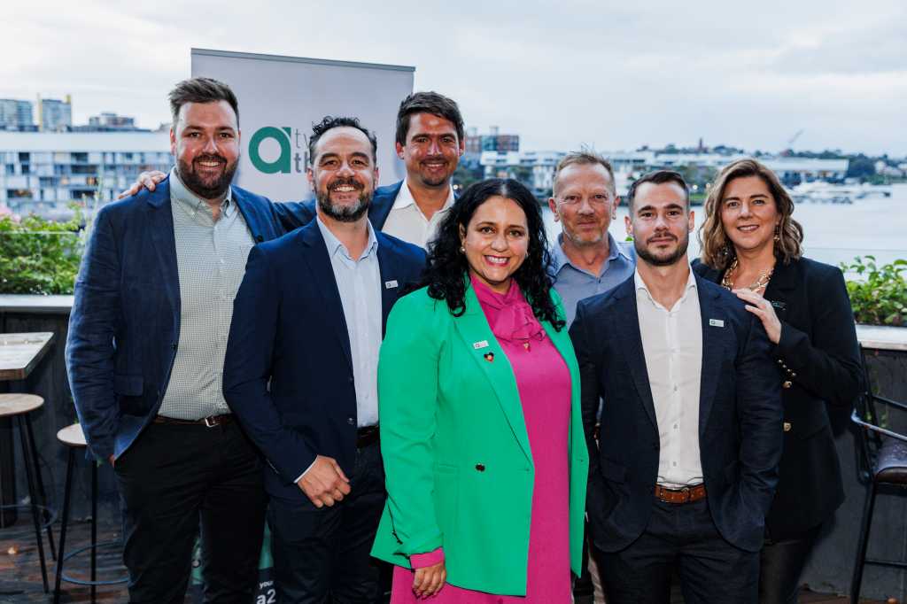 A photograph of A23 employees at the company's Sydney office launch event in Barangaroo, with CEO Natalie Legg pictured centre.