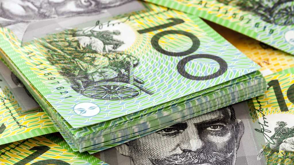 A close-up photograph of Australian $100 notes.