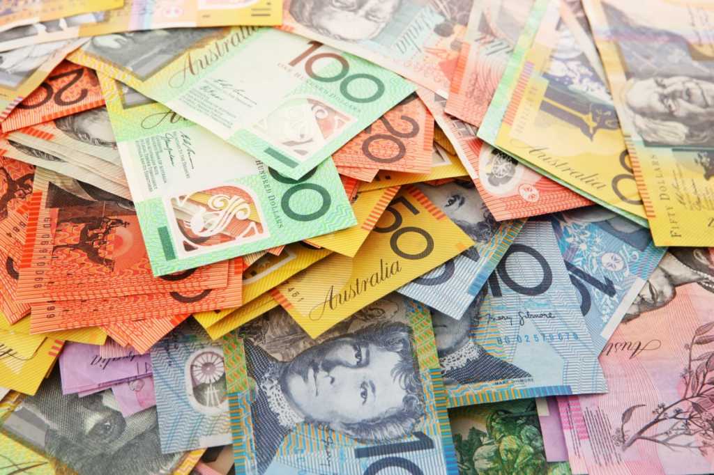 A pile of Australian money in $5, $10, $20, $50 and $100 denominations.