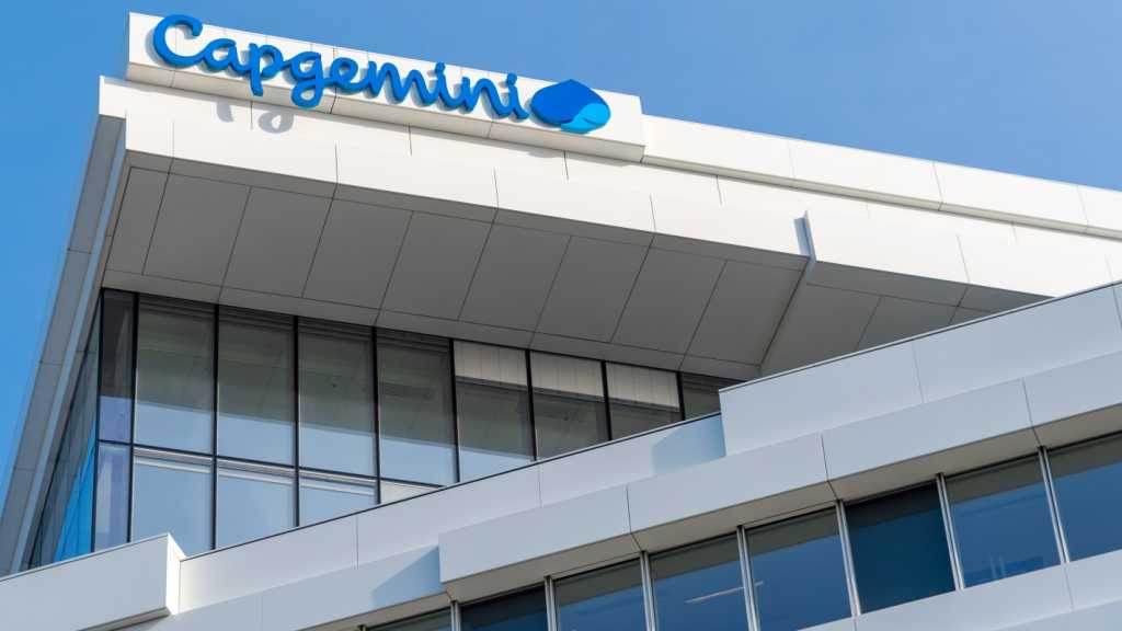 A photograph of a building with the Capgemini logo on the facade.