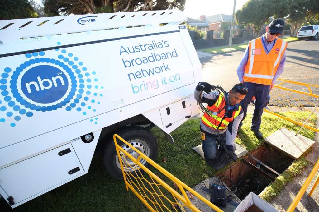 Two men working for nbn on cabling on kerb side